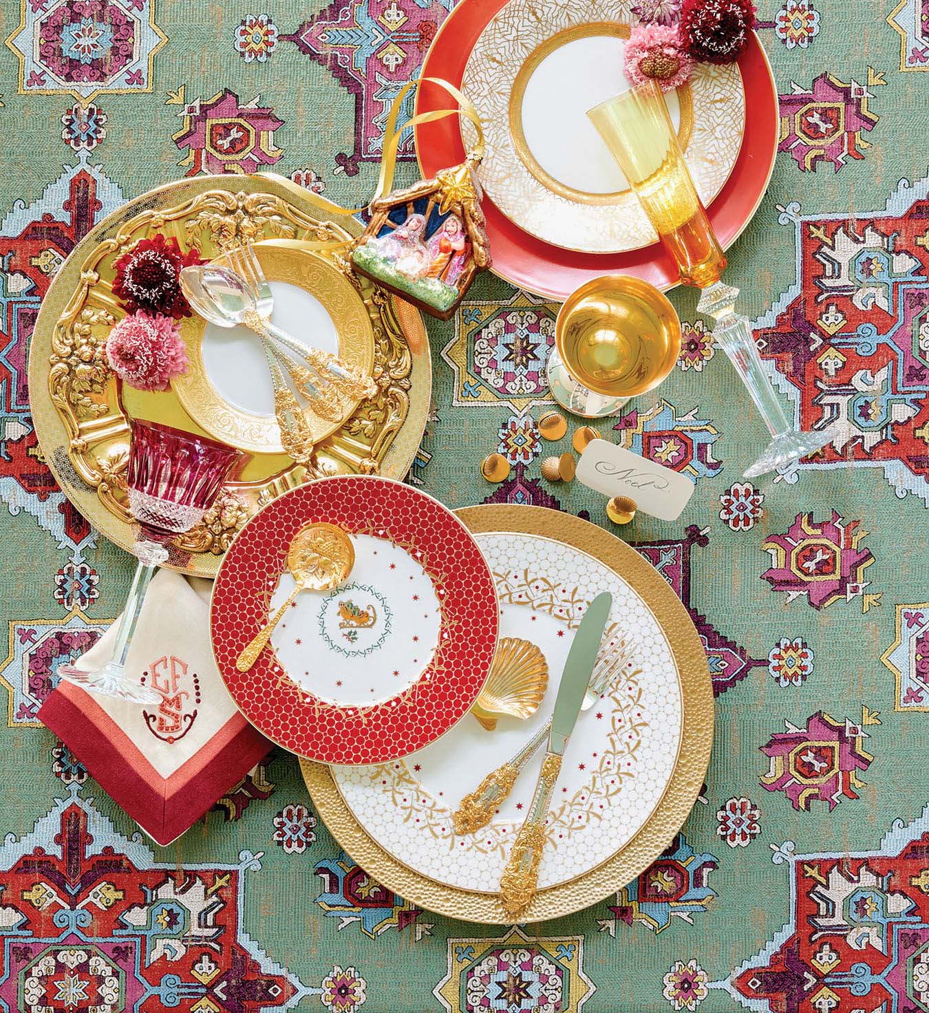 Holiday table setting in reds and golds