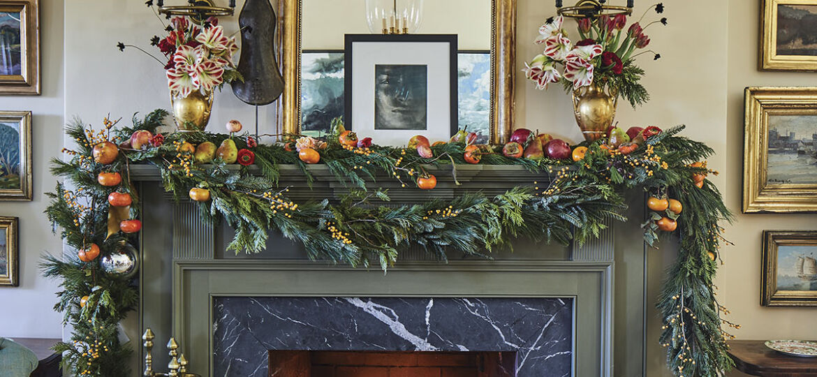 garland accented with pomegranates, apples, and persimmon branches, designed by Lagniappe in Greenville