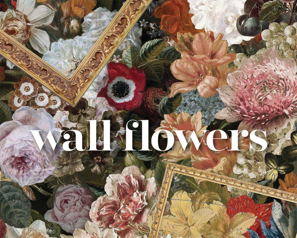 A bold floral wallpaper on a dark background featuring many varieties of flowers illustrated in the Dutch Masters style