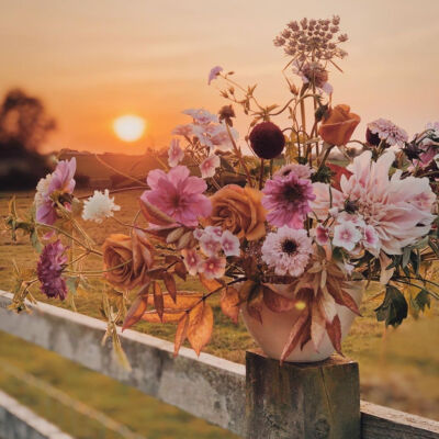 Top 20 Instagram Posts of 2020, fall floral arrangement by @pigpenflowers photographed against a sunset by @jannelford