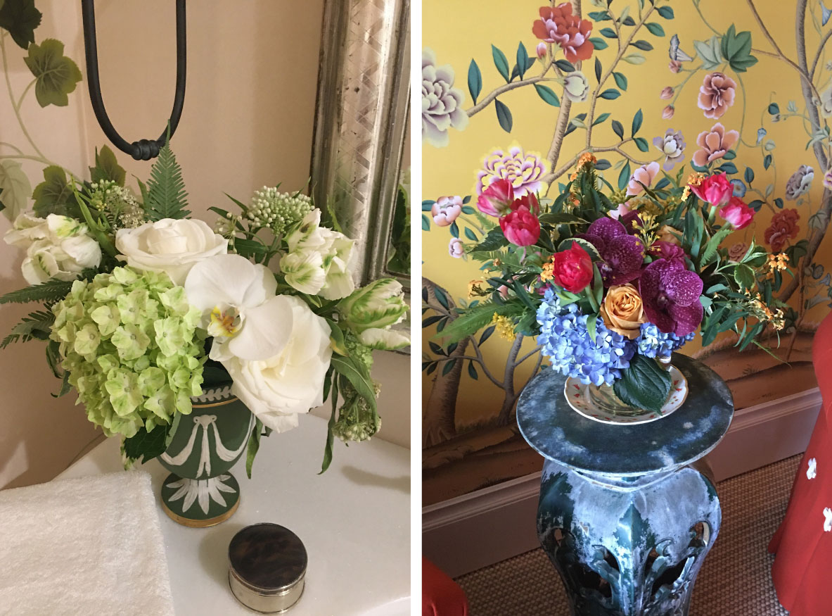 (left) green and white floral floral arrangement by the bathroom sink. (right) colorful floral arrangement with blue hydrangeas, purple orchids, hot pink tulips, and coffee colored roses, mirroring the wallpaper behind it