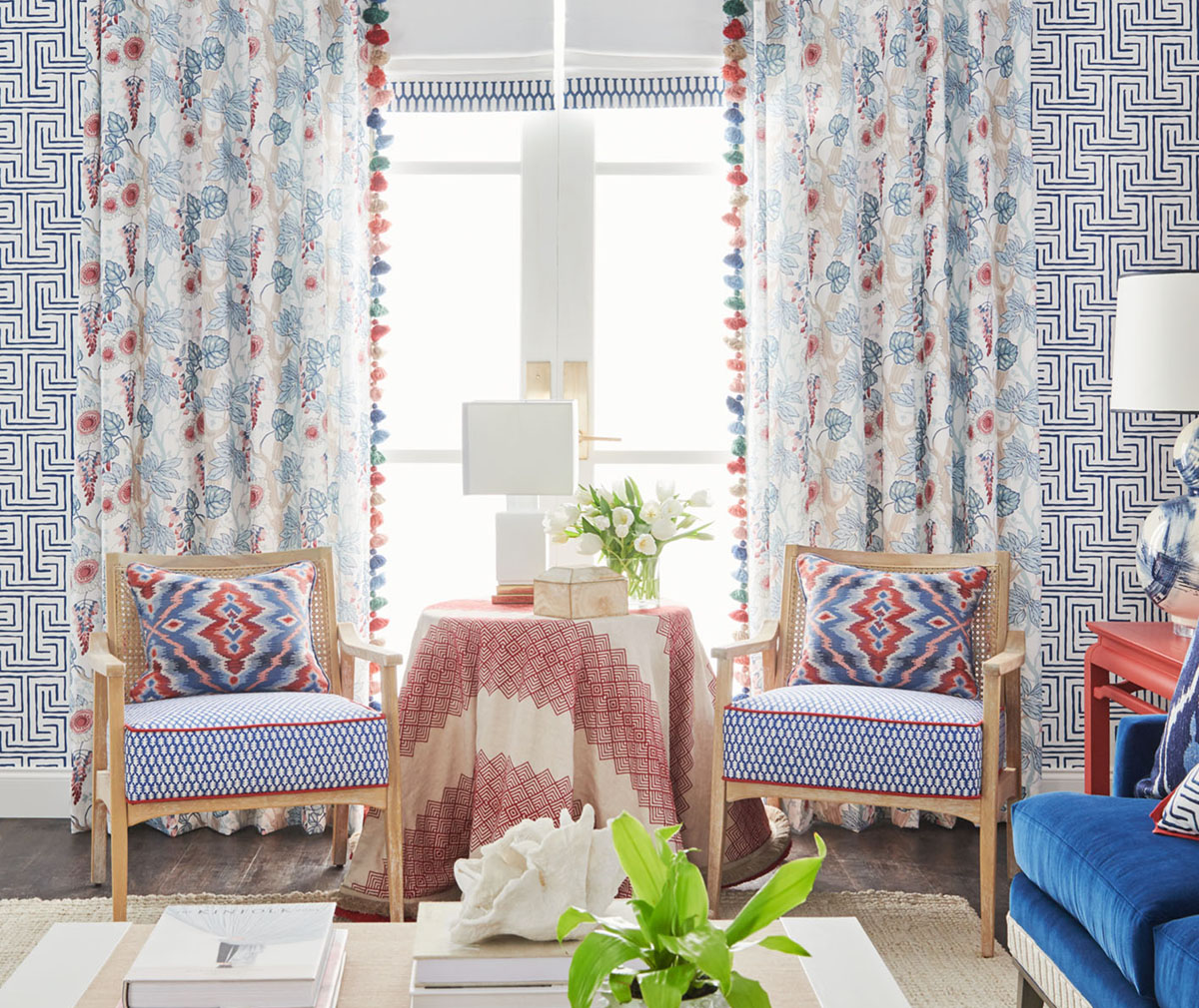 Room decorated in blue and white with pops of red using Stroheim Color Collection.