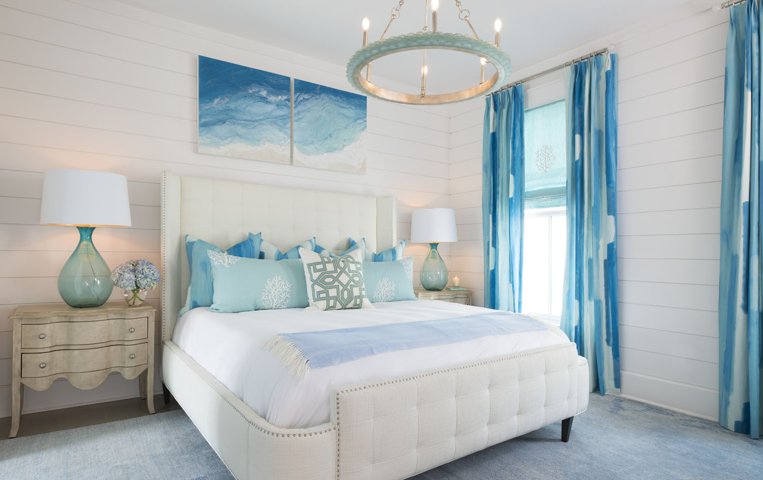 Shay Geyer bedroom with white walls and fabrics in aqua tones