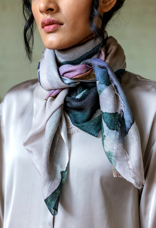 A floral silk by Safiyyah Choycha, modeled as a neck scarf
