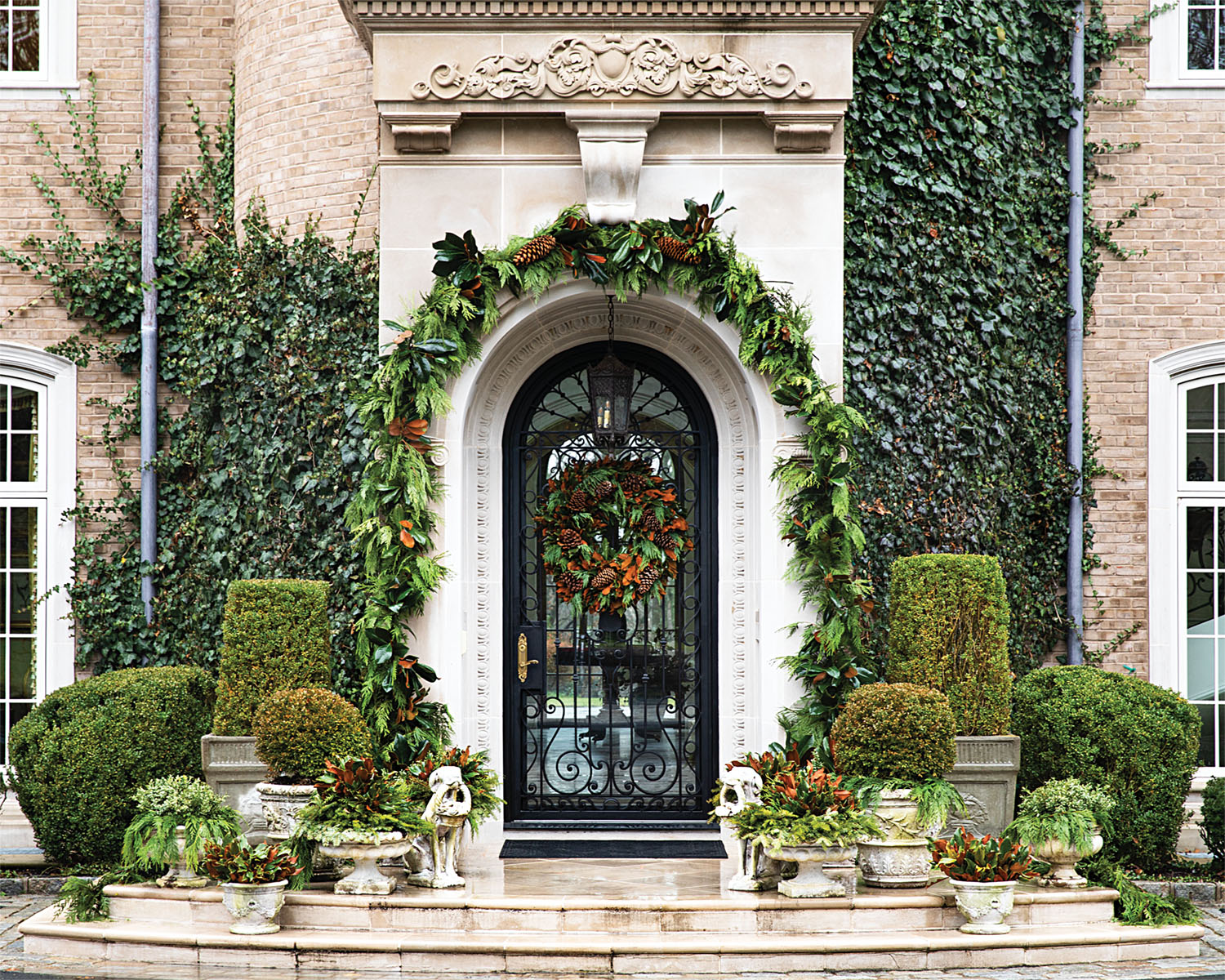 Holiday Front Door Decor, garland archway, wreath, potted containers