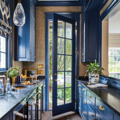 blue cabinets in a kitchen renovated by Mathews Design Group