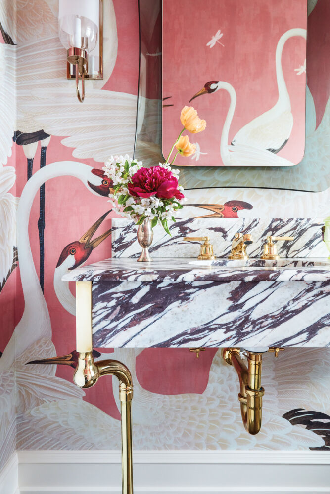 Crane wallpaper and marble sink in a Summer Thornton designed bath