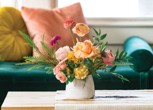 Small arrangement of ranunculus, roses, and carnations