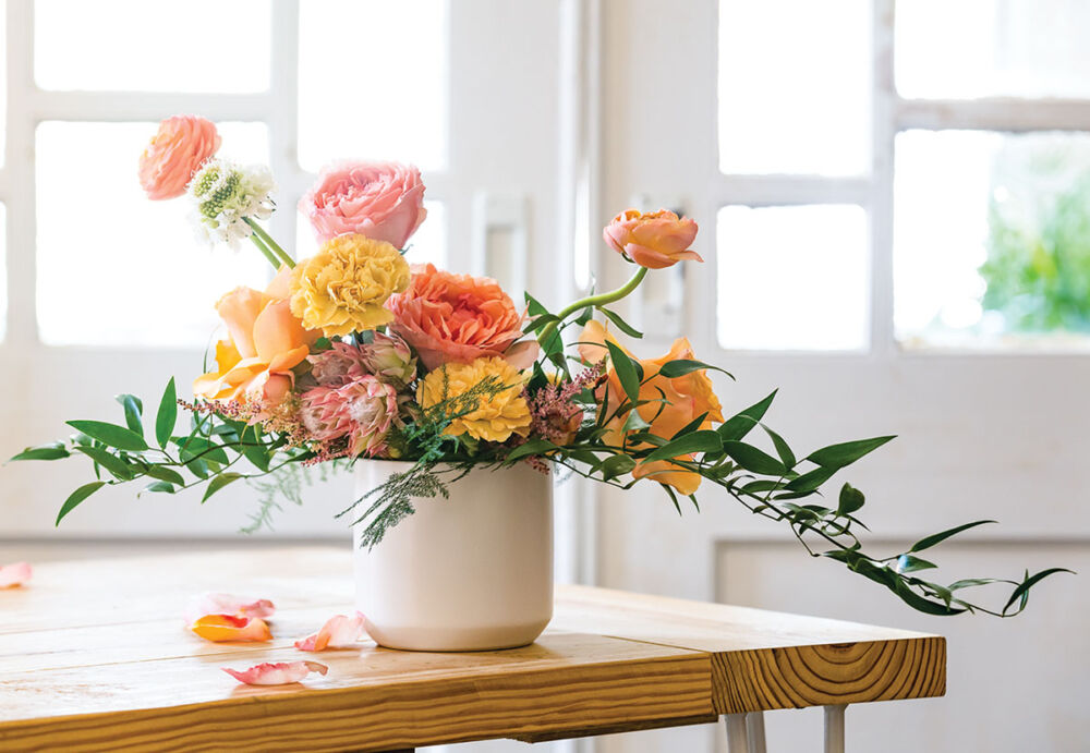 Bree Iman Clarke's sunny arrangement of carnations, roses, protea, ranunculus