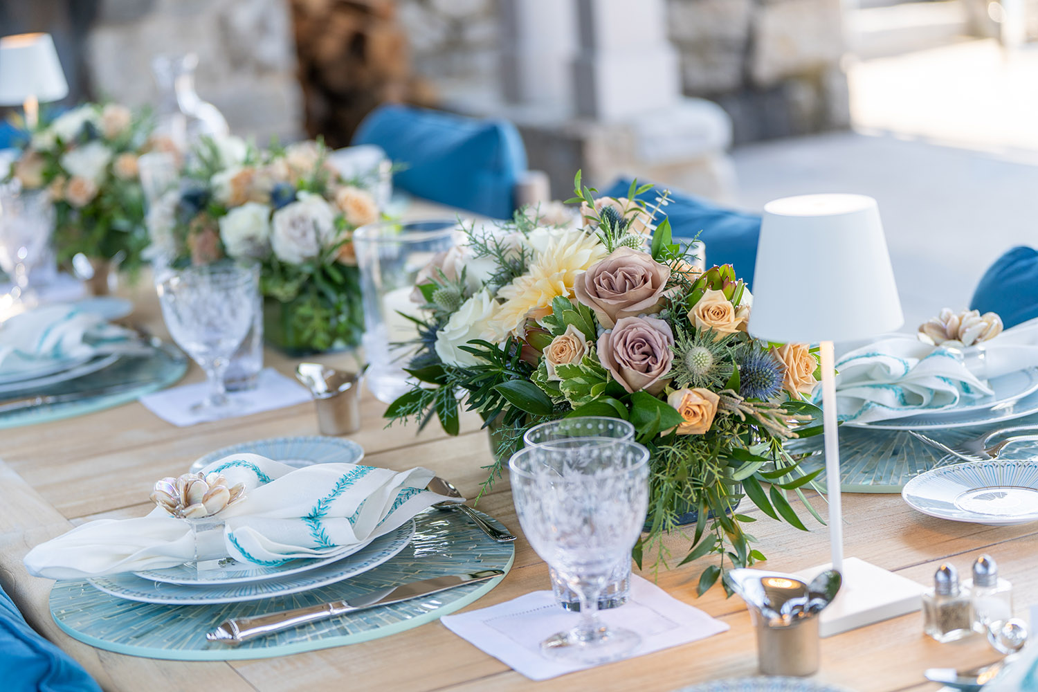 Flower arrangements and table settings at Anne Hamilton's dinner party