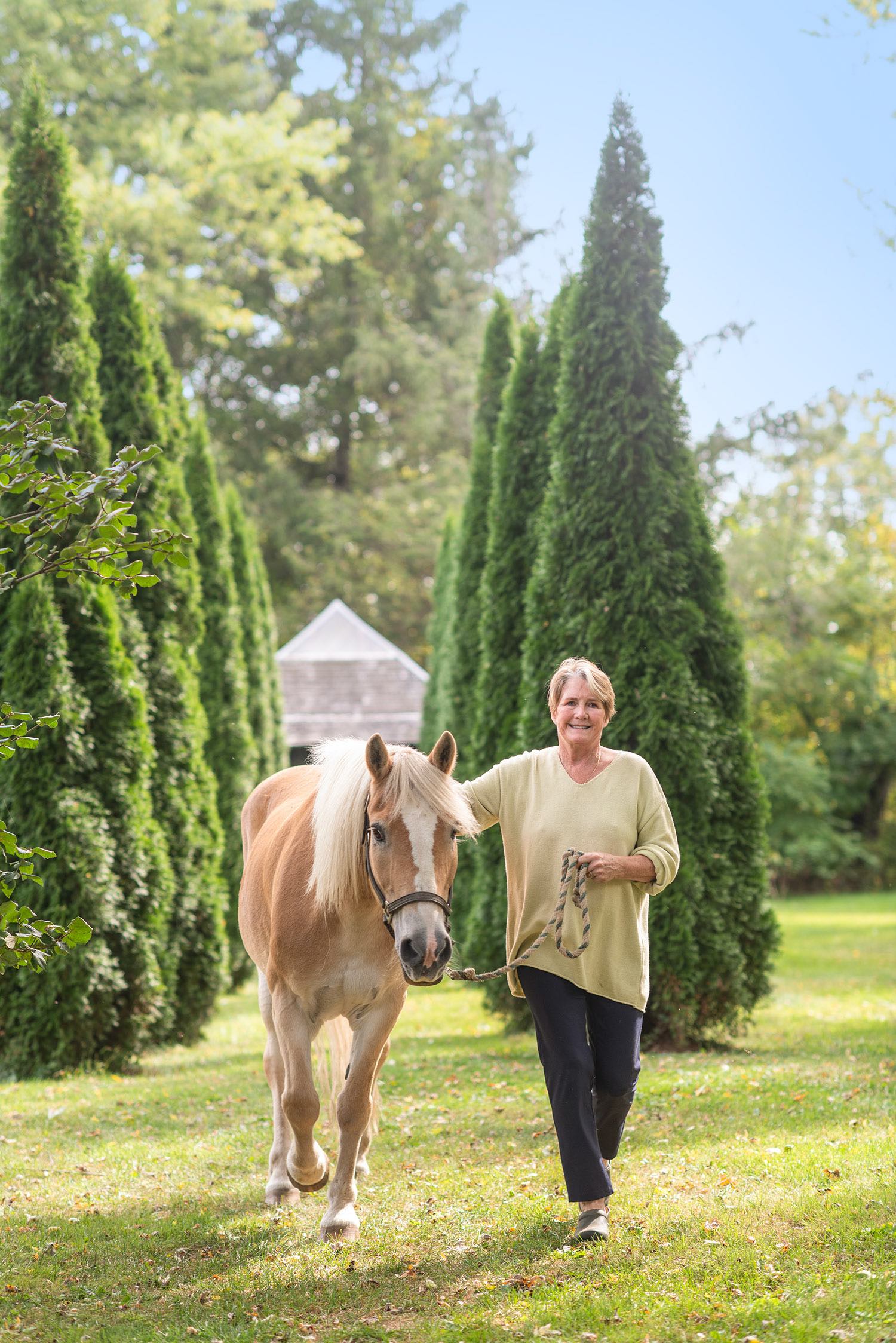 Maria walking rescued horse, Grace Kelly