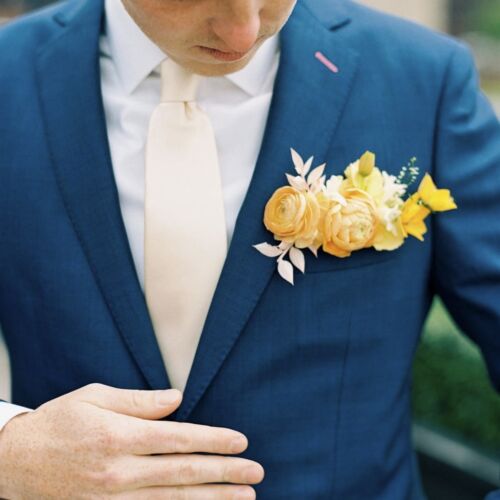 Yellow pocket square boutonniere