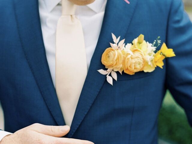 Yellow pocket square boutonniere