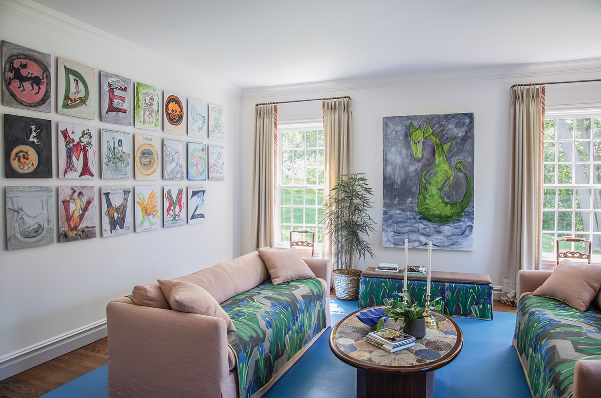 Gallery/living room with alphabet paintings on wall