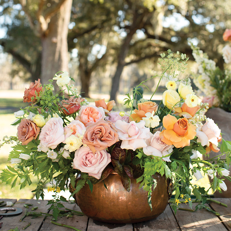 Fall centerpiece of roses with lettuce and garden vegetables