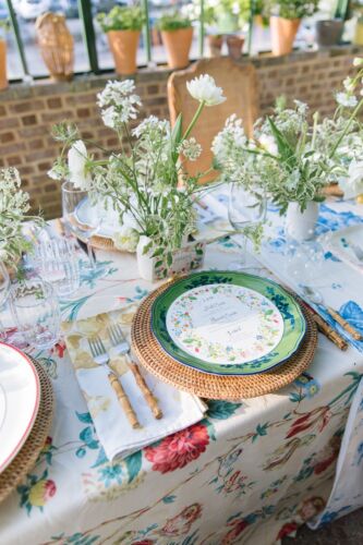 Table setting with menu and white flowers
