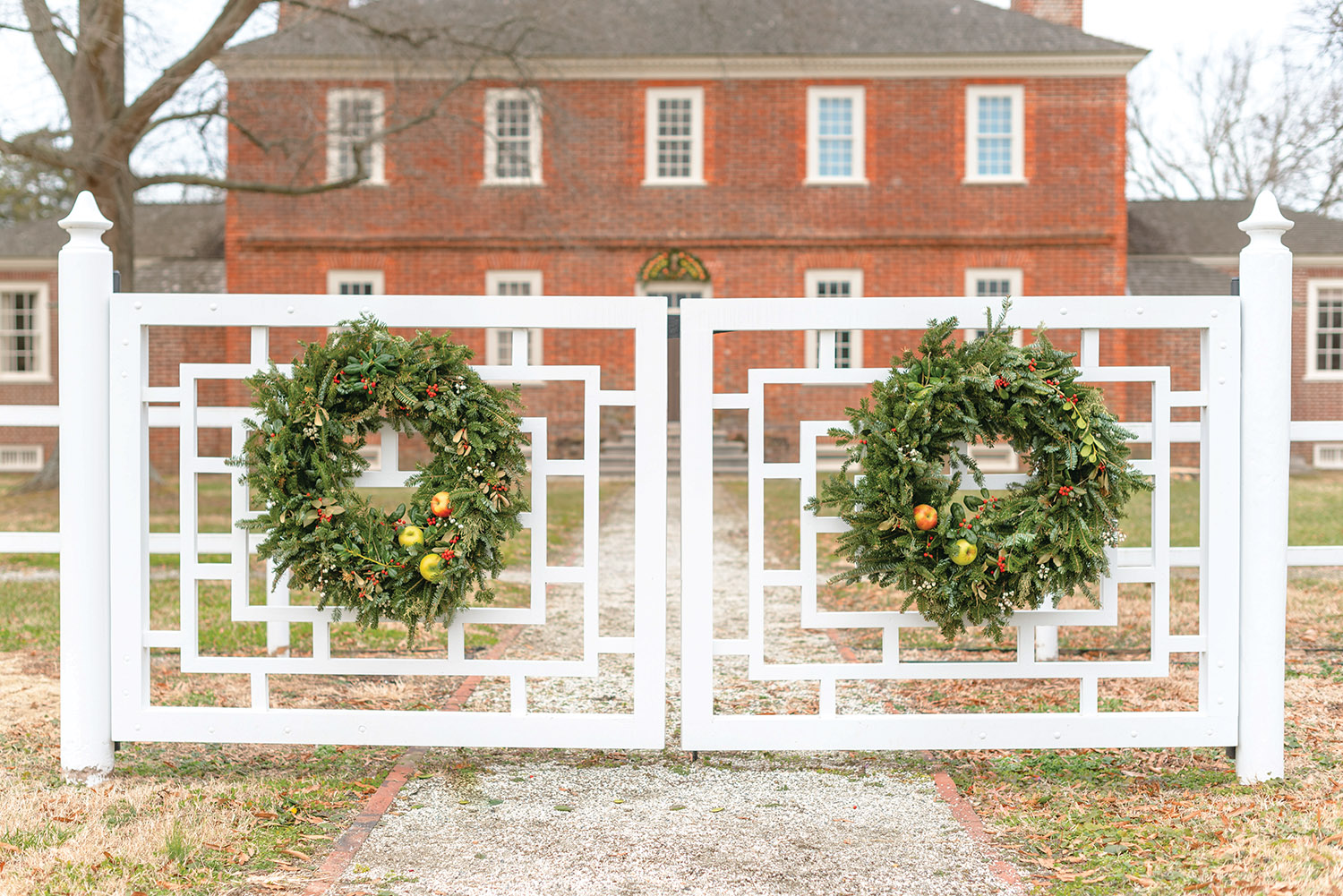 Holiday wreaths on gate at the entrance to Brooke's Bank historic home.