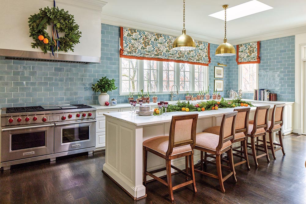 kitchen island decorated with citrus and greenery