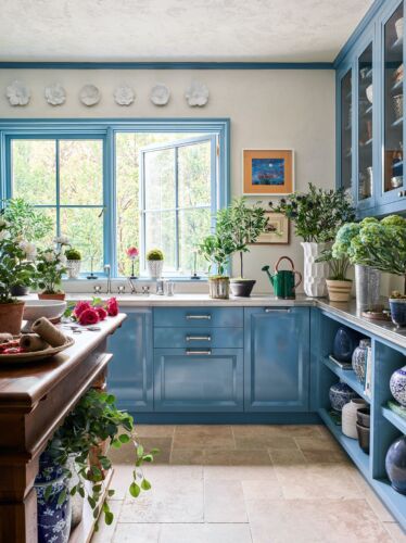 Laundry/cutting room designed by Bunny Williams. Blue cabinets and zinc countertops