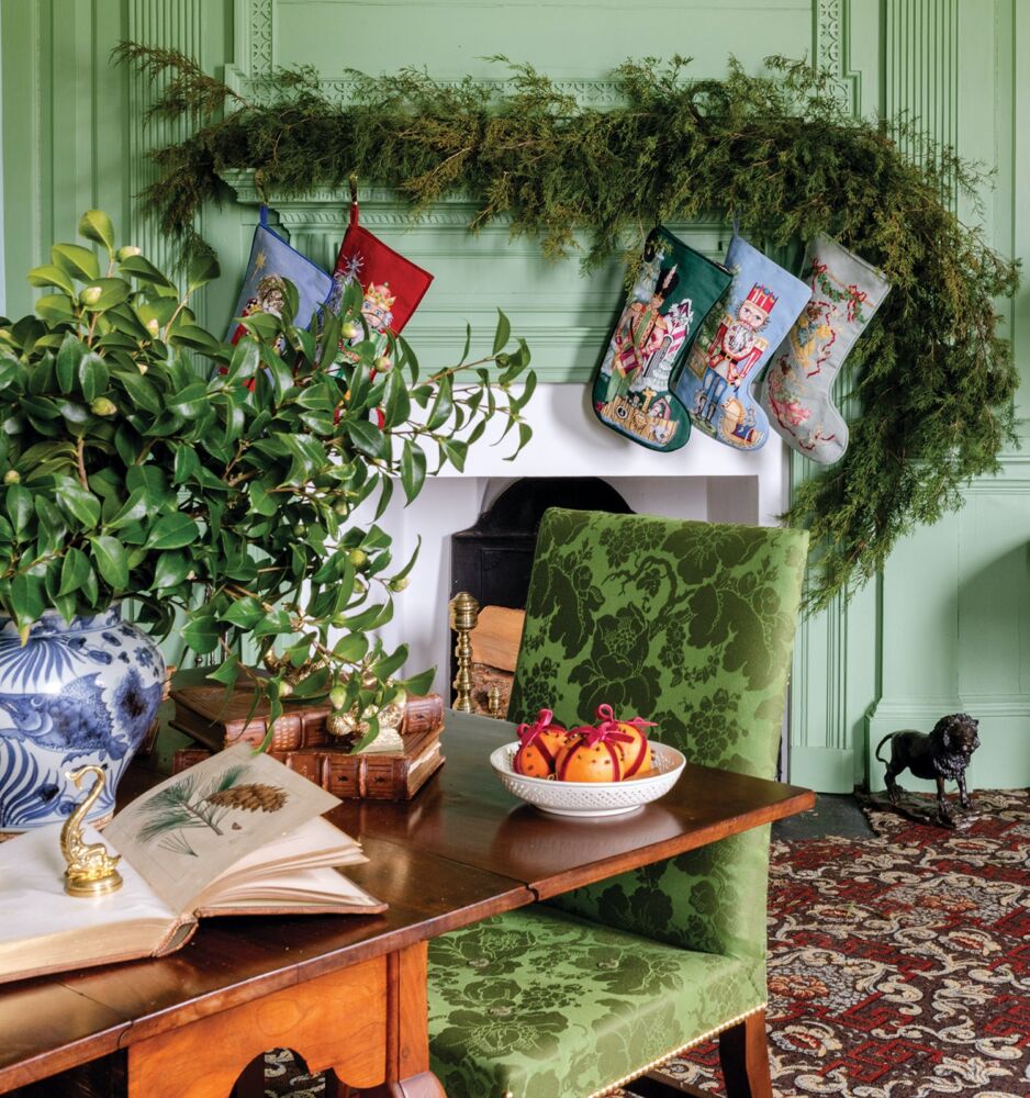 Dining room mantel with greenery and needlepoint stockings at Brooke's Bank