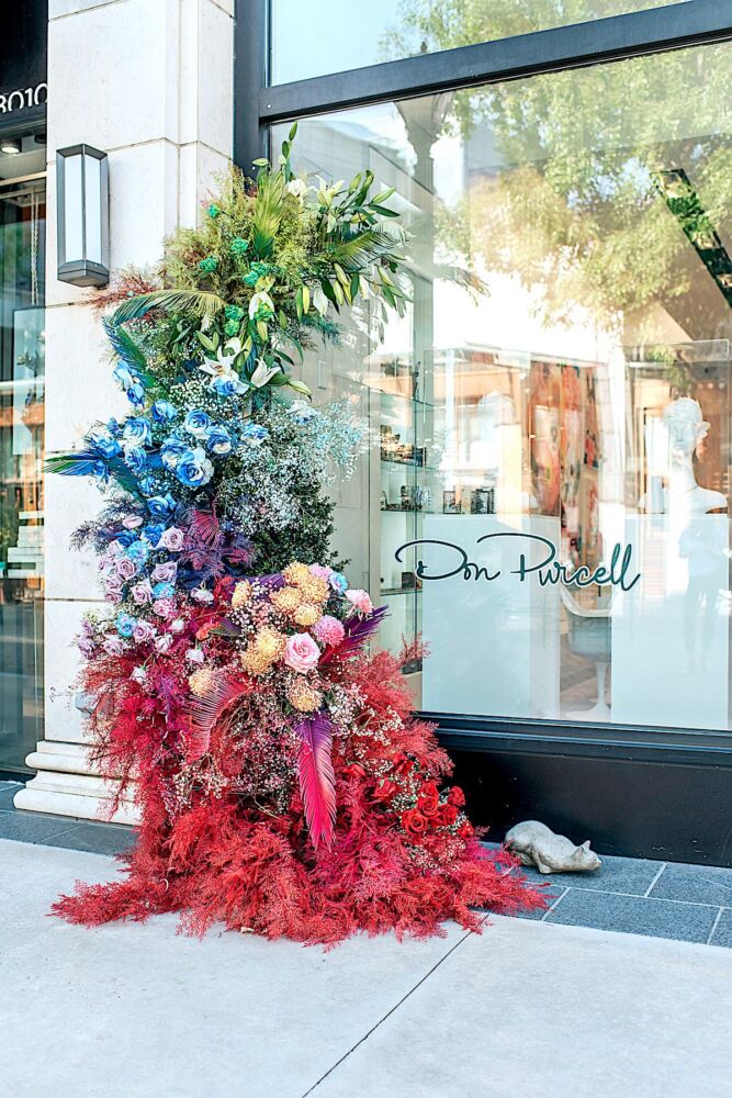 Rainbow-colored floral installation by Pinker Times outside the Don Purcell store in Buckhead Village, Atlanta
