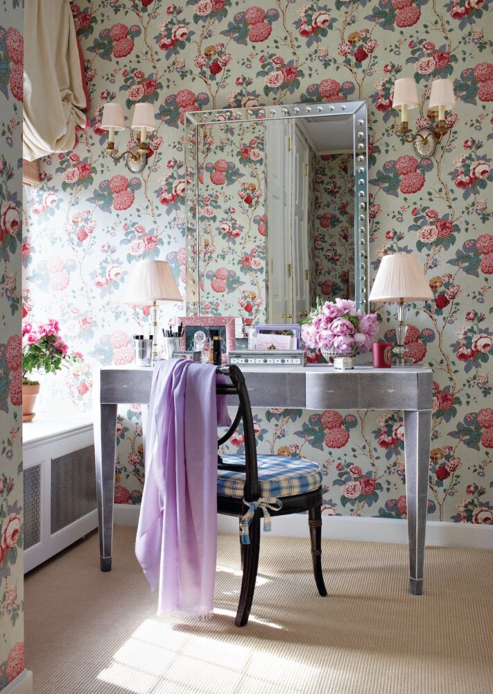 Dressing room with hydrangea and rose wallpaper.