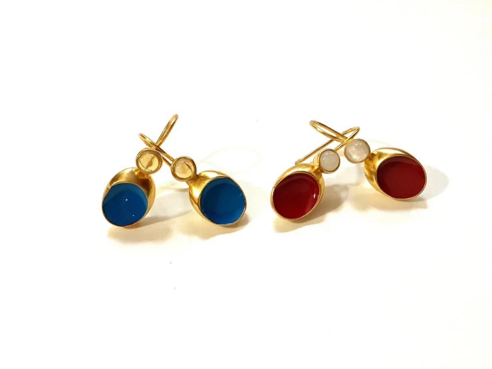 Blue and red bejeweled gold drop earrings.