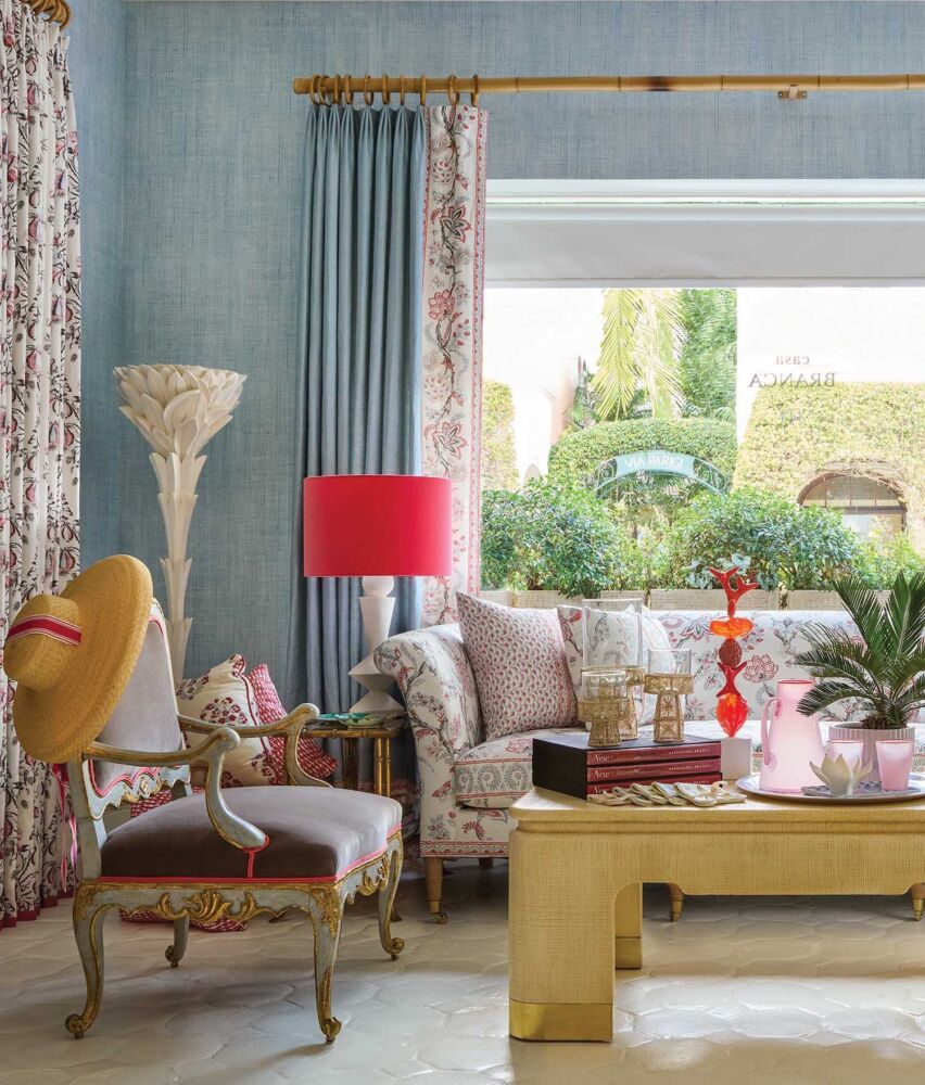 Eclectic mix of furnishings with pops of red and pink in Casa Branca, Palm Beach
