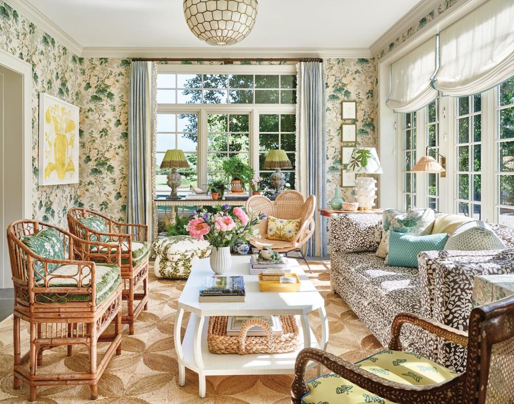 Sunroom with Schumacher’s iconic Hollyhock fabric covers the walls.