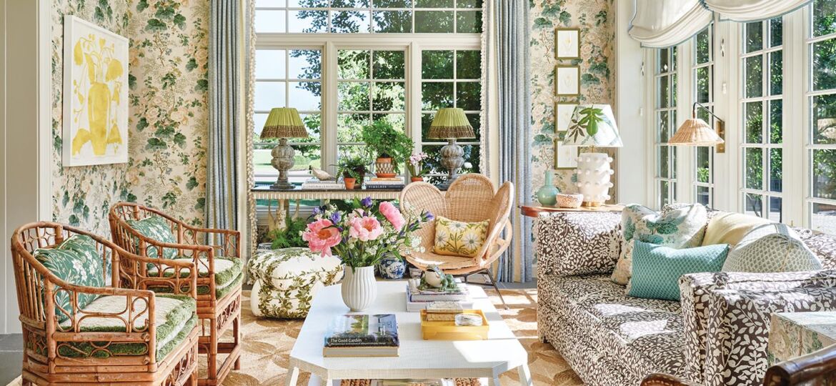 Sunroom with Schumacher’s iconic Hollyhock fabric covers the walls.