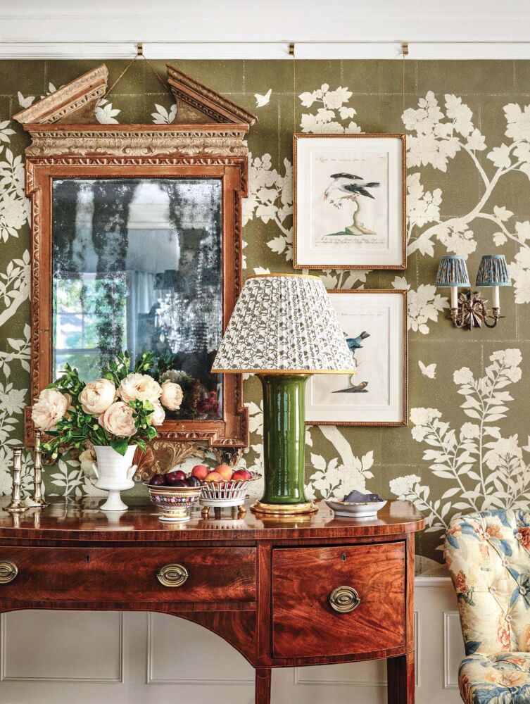 The antique broken pediment mirror and bird etchings hung the “old-fashioned” way using cables and clips tacked to the picture molding to maintain the pristine condition of Gracie wallpaper panels.