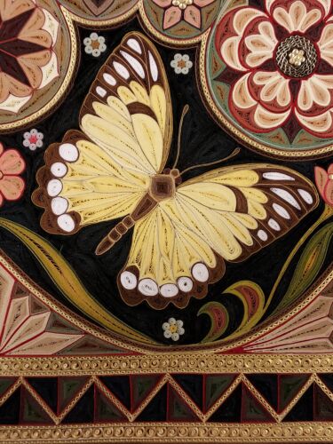 A close up of the Grand Jardin quilling piece shows a yellow butterfly made up of tightly wound paper.