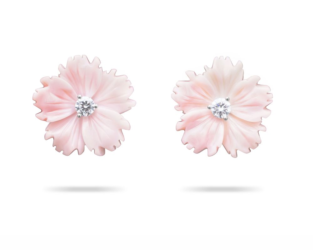 Pink earrings shaped like flowers.