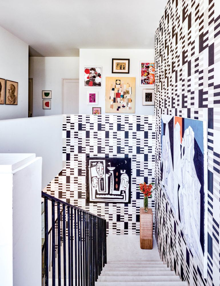 Geometric Wallpaper covers a stairwell.