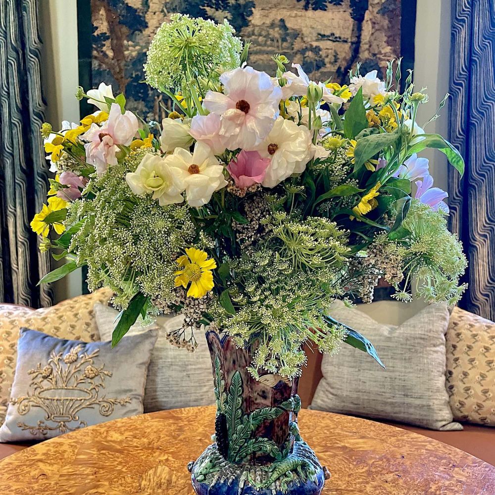 Majolica vase filled with queen Anne's lace, cosmos, and other summer flowers