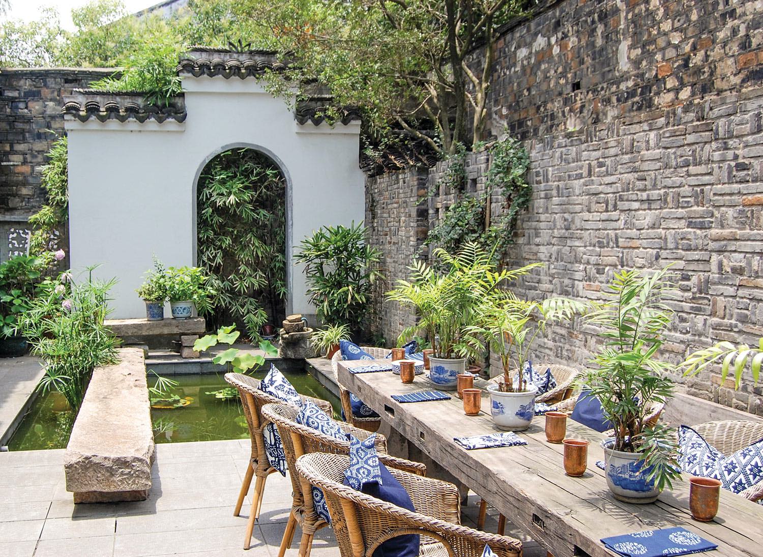 a collection of the line's blue-and-white patterns makes a statement in a courtyard garden in Suzhou, China.