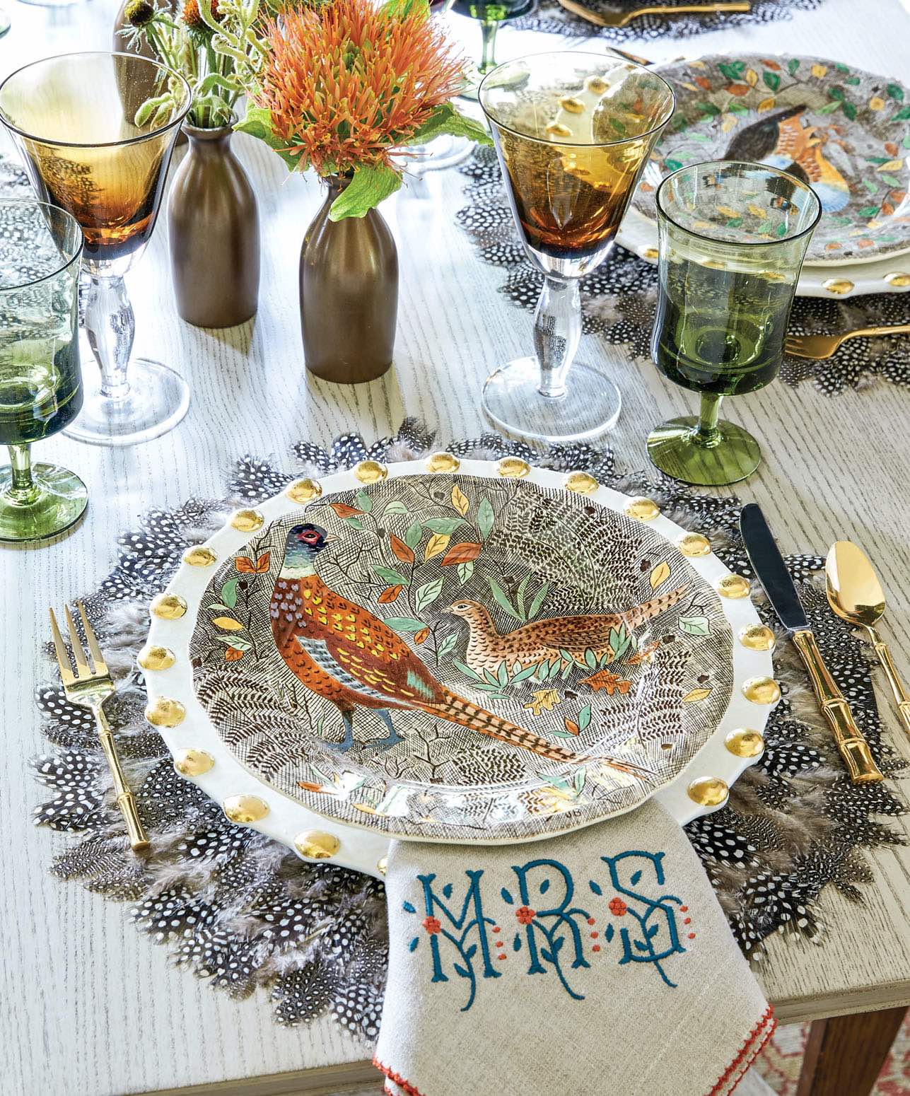 Elegant farmhouse table setting with feather placemat