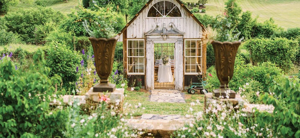 A repurposed shed has a wedding table up inside at Hope Flower Farm