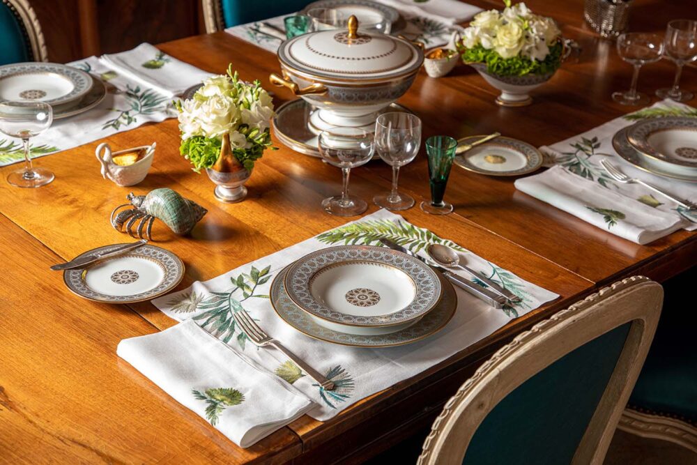 A table is set with a green and white color scheme.