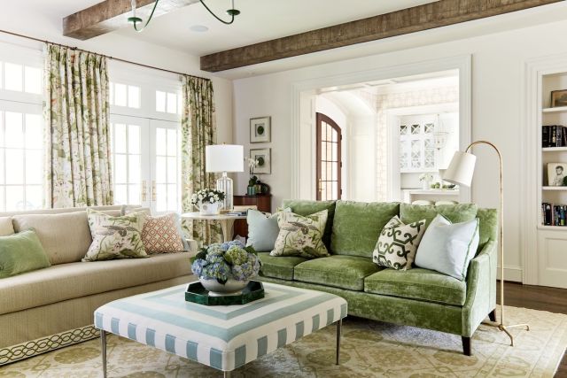 Living room addition with two new sofas upholstered in different fabrics and textures to give the impression that pieces were passed down from different family members.