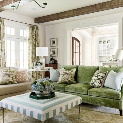 Living room addition with two new sofas upholstered in different fabrics and textures to give the impression that pieces were passed down from different family members.