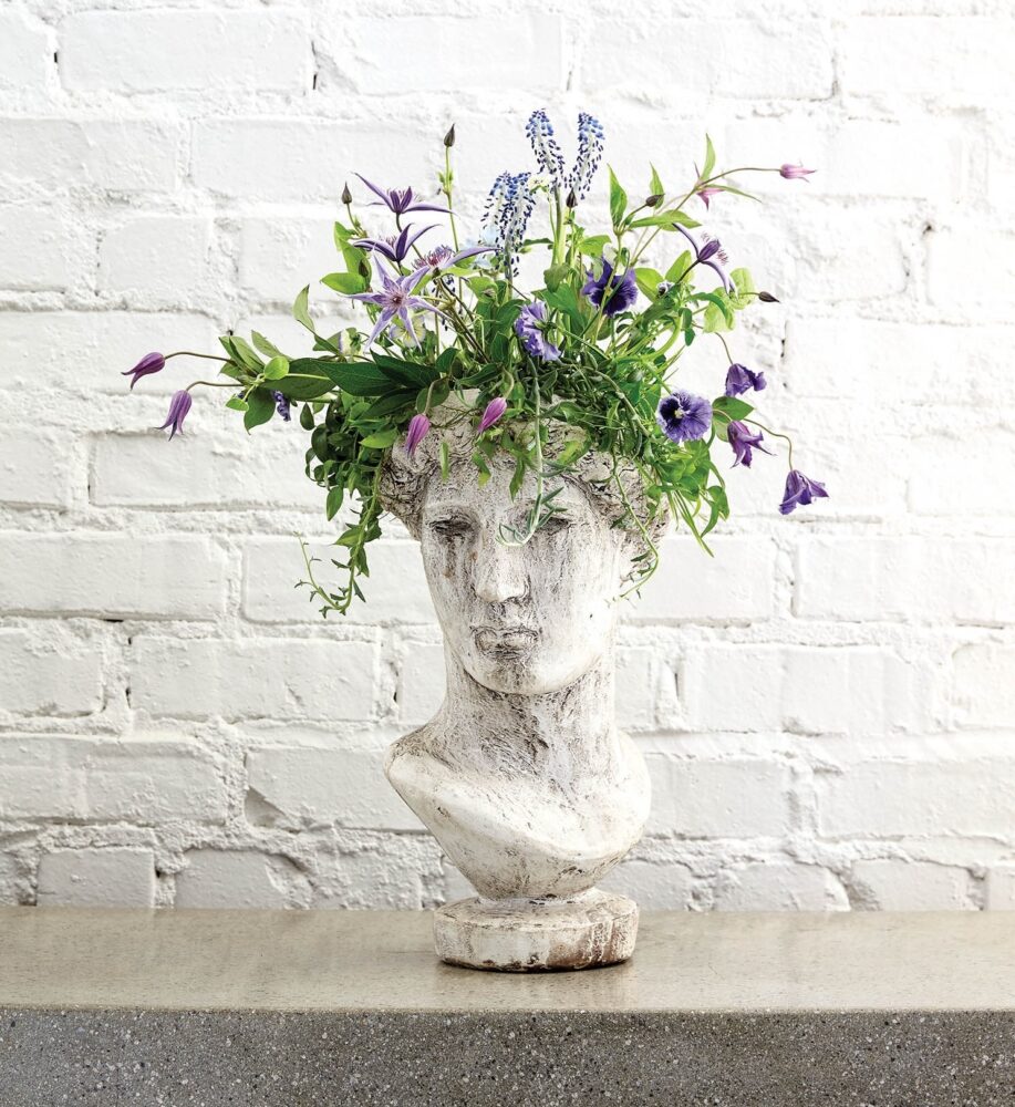 Faux classical bust with flower arrangement crown