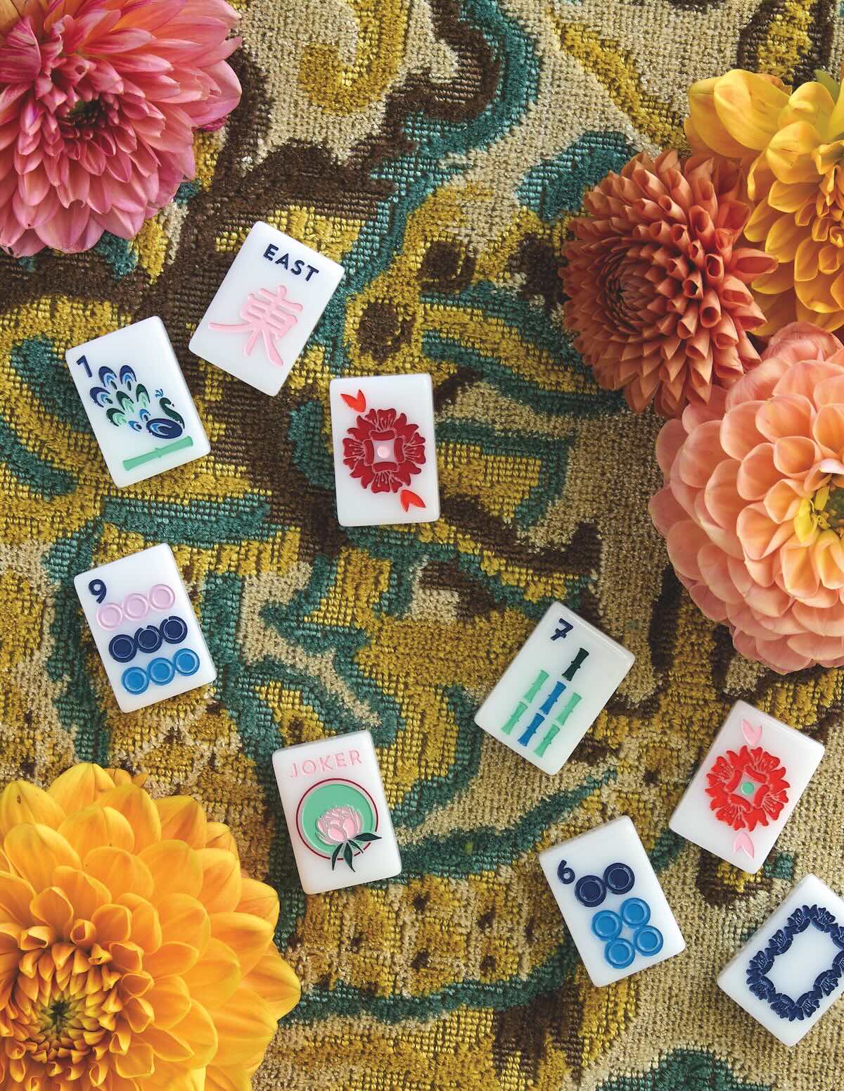 Mahjong tiles on tapestry fabric with dahlia flowers