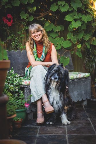 Susy Paisley and Bonn, her Romanian sheepdog, in their own natural habitat, her garden in Kent, England.
