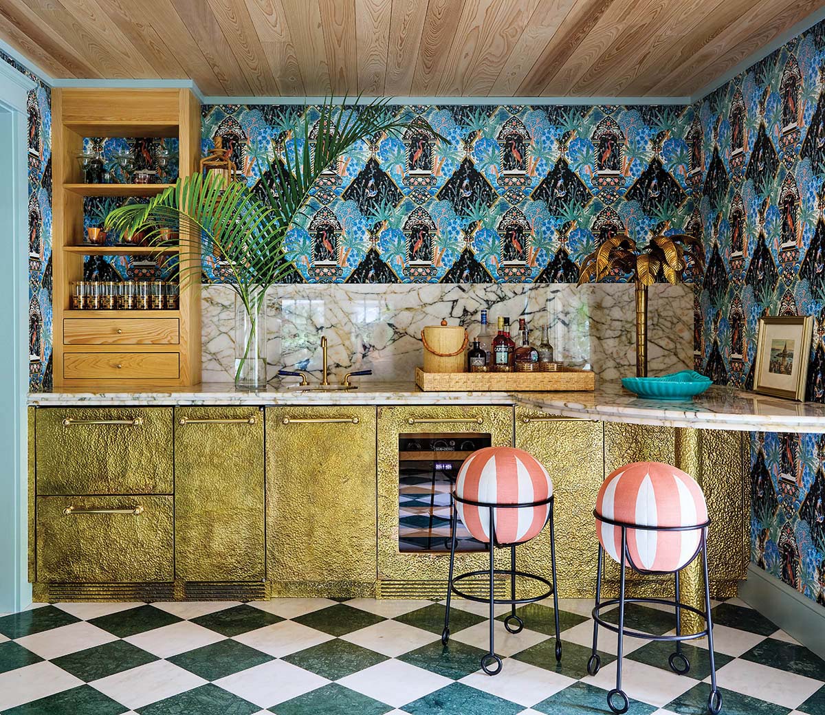 a cabana bar gleams in hammered-brass cabinetry