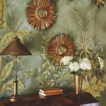 entry foyer with floral Gracie wallpaper with an antique cabinet, and starburst mirrors