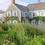 Colorful blooms cover the entrance of this Nantucket home.