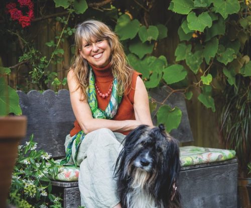 Susy Paisley and Bonn, her Romanian sheepdog, in their garden in Kent, England.