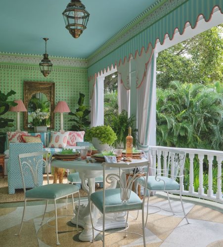 Open porch or sun room with blue ceiling, green latticed wall